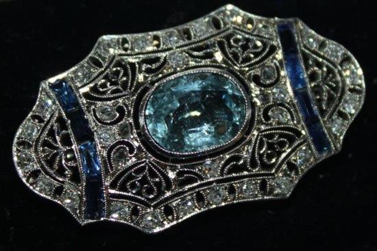 Art Deco brooch set with central stoned aquamarine with blue stones & diamonds in white gold